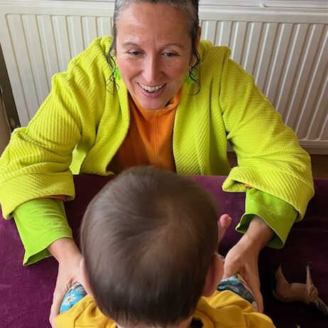 Ruth is playing with a kid